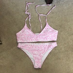 Pink and white two piece bathing suit